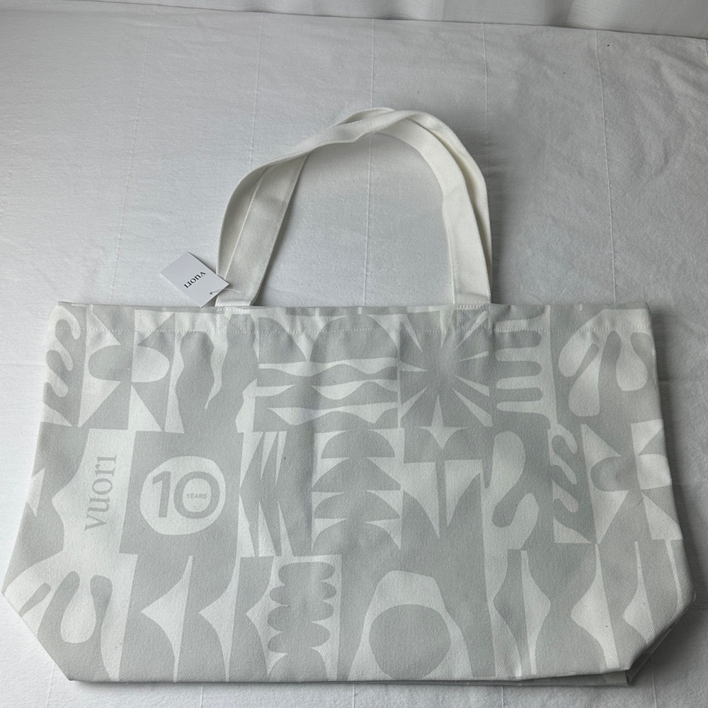 Vuori 10 year anniversary Gray and White Tote Bag